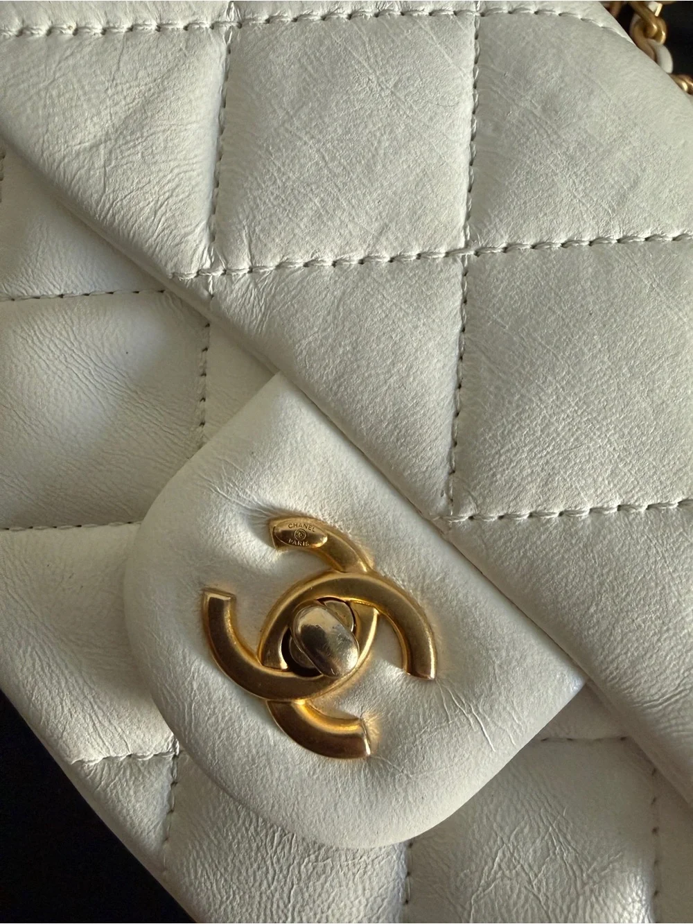 CHANEL White Quilted Mini Flap Bag with Gold Chain and CC Turn-Lock